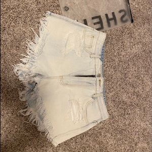 Fringe light washed shorts